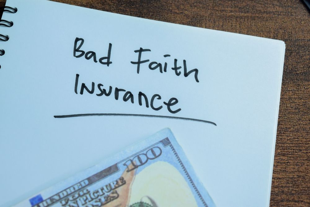 Concept of Bad Faith Insurance write on book isolated on Wooden Table.