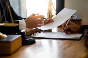 Attorneys or lawyers who are reading the statute of limitations Consultation between male lawyers and business clients, tax and legal and legal services firms.