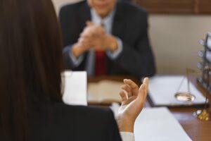 Young Lawyer Discusses Contract Law with Senior Attorney