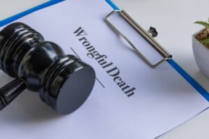 Wrongful Death Document on Clipboard with Gavel
