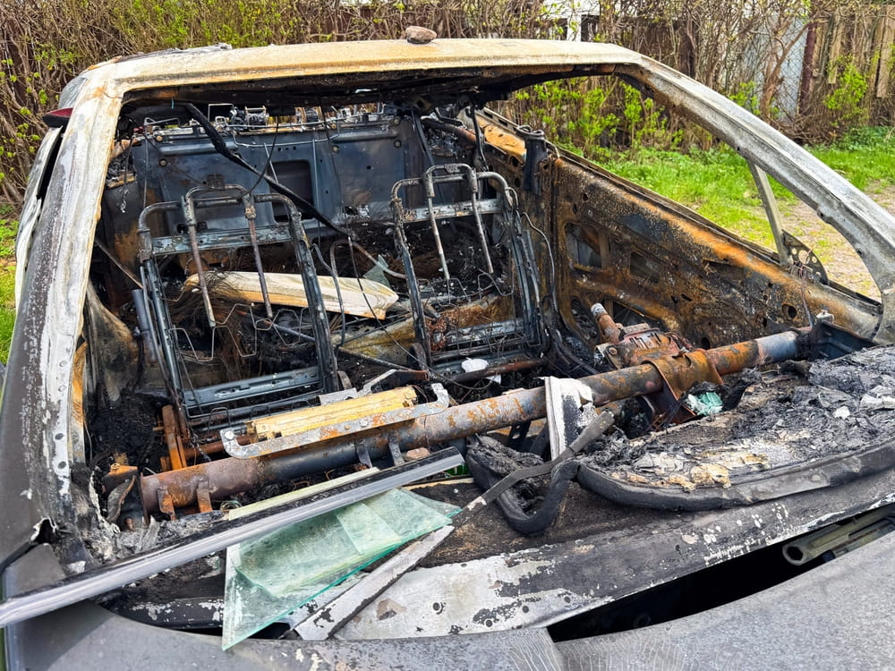 Burned-out car interior after a vehicle fire